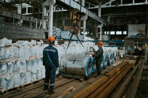 The production of ventilation and gutters, loading on a crane Stock Photos