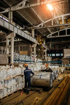 The production of ventilation and gutters, loading on a crane Stock Photos