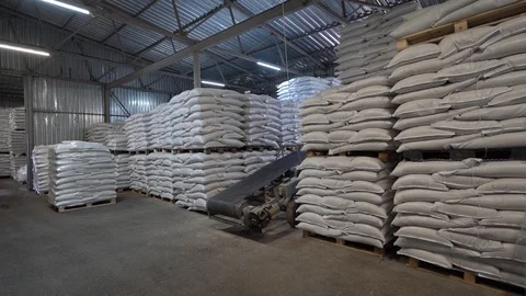 Production warehouse with folded white sacks of feed for rural animals Stock Footage 127293239