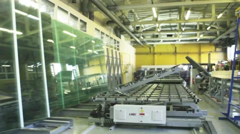 Production of Windows: robot picks up a large piece of glass Stock Footage 45546318