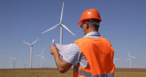 Production Worker Man Examining Project Design Electric Tower Clean Electricity Stock Photos