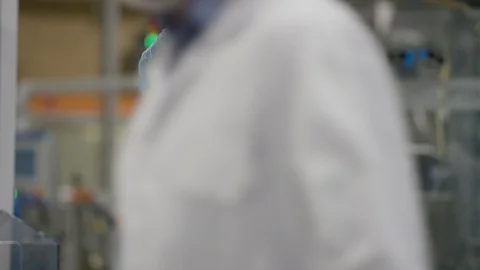 Production worker smiling at camera while working at production line Stock Footage 107997607