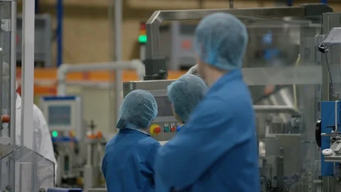 Production worker smiling at camera while working at production line Stock Footage 107997898