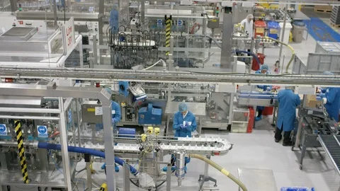 Production workers working on production line in cosmetic factory Stock Footage 107965552