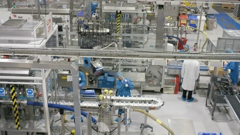 Production workers working on production line in cosmetic factory Stock Footage 107966094