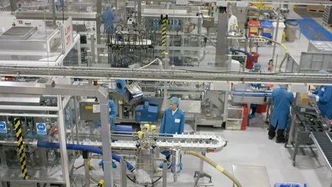 Production workers working on production line in cosmetic factory Stock Footage 107966319