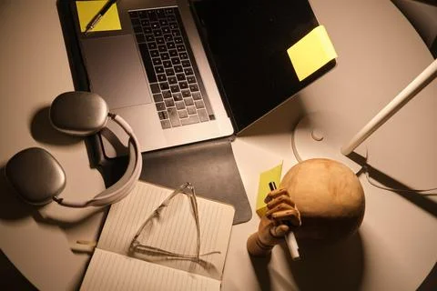Productive study area setup with laptop and headphones Fotos Stock