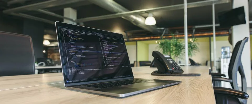 Productive work environment with coding and programming in a modern office Stock Photos