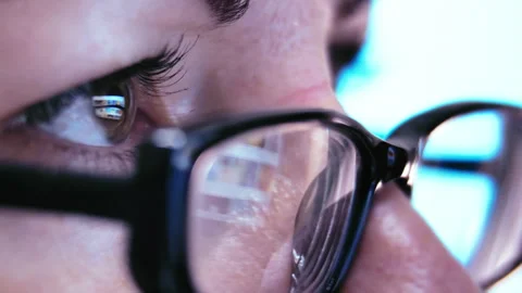 Productive Work Session: Close-up of Woman's Eyeglasses Reflecting Laptop Stock Footage 252690604