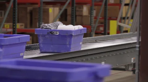 Products in bin - riding on conveyor Stock Footage 36790468