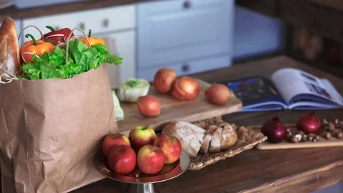Products on the kitchen table after going to the store Stock Footage 127624720