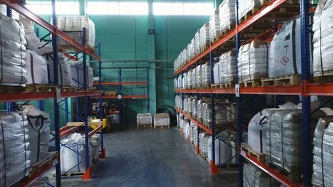 Products at the warehouse. Back camera move between the rows shelves Stock Footage 124038864