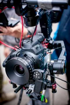 Profeccional cinema camera on a 3-axis camera stabilizer system on a commerci Stock Photos