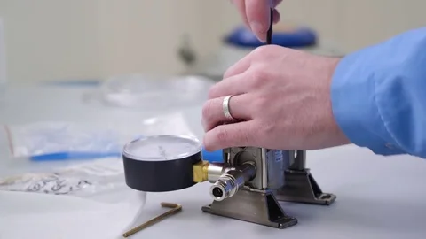 Professioanl engineer testing machine. Close up of technician with gloved hand Stock Footage 77696133