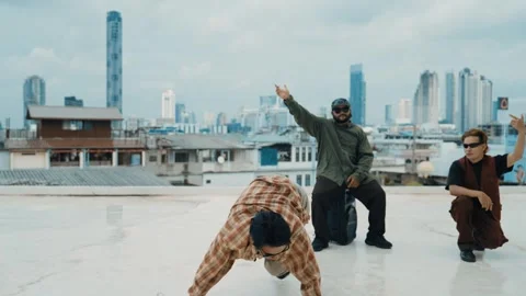 Profession break dancer practice B-boy dance with friends at roof top. hiphop. Stock Footage 258061982