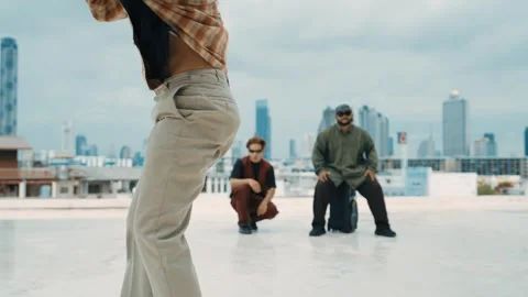 Profession break dancer practice B-boy dance with friends at roof top. hiphop. Stock Footage 258210140
