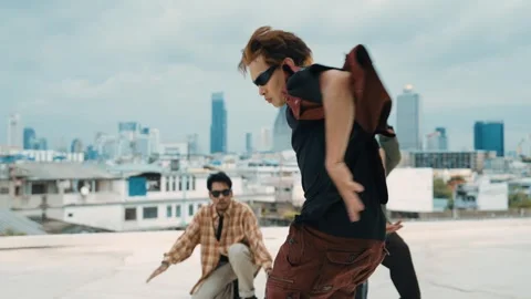 Profession break dancer practice B-boy dance with friends at roof top. hiphop. Stock Footage 258227774