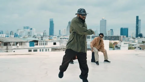 Profession break dancer practice B-boy dance with friends at roof top. hiphop. Stock Footage 258233457