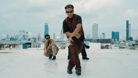 Profession break dancer practice B-boy dance with friends at roof top. hiphop. Stock Footage 262668633