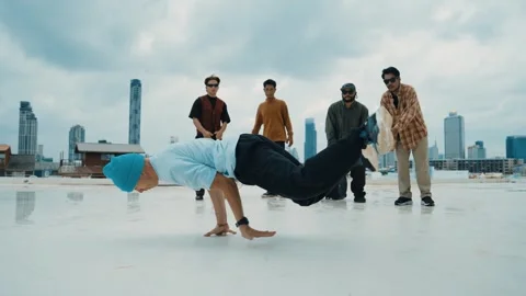 Profession break dancer practice B-boy dance with friends at roof top. hiphop. Stock Footage 263227456