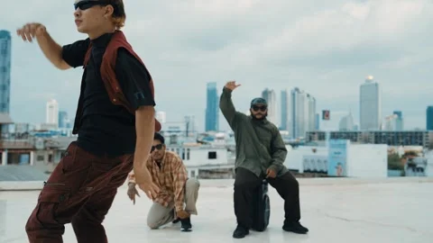Profession break dancer practice B-boy dance with friends at roof top. hiphop. Stock Footage 263504710
