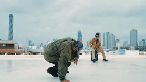 Profession break dancer practice B-boy dance with friends at roof top. hiphop. Stock Footage 263664101