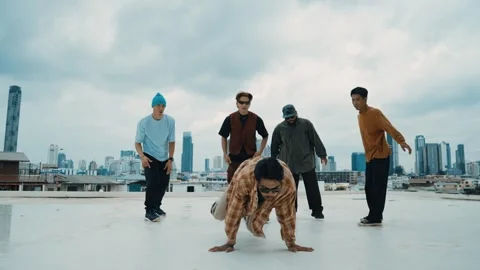 Profession break dancer practice B-boy dance with friends at roof top. hiphop. Stock Footage 263664197