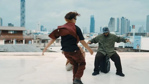 Profession break dancer practice B-boy dance with friends at roof top. hiphop. Stock Footage 263678636