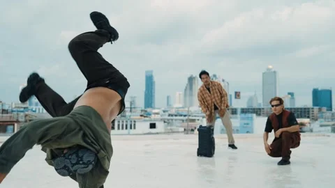 Profession break dancer practice B-boy dance with friends at roof top. hiphop. Stock Footage 264098807