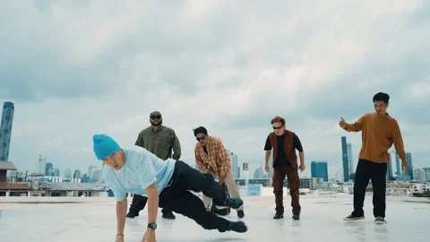 Profession break dancer practice B-boy dance with friends at roof top. hiphop. Stock Footage 264129260