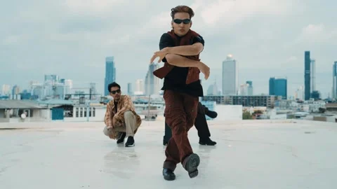 Profession break dancer practice B-boy dance with friends at roof top. hiphop. Stock Footage 264136193