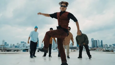 Profession break dancer practice B-boy dance with friends at roof top. hiphop. Stock Footage 264275956
