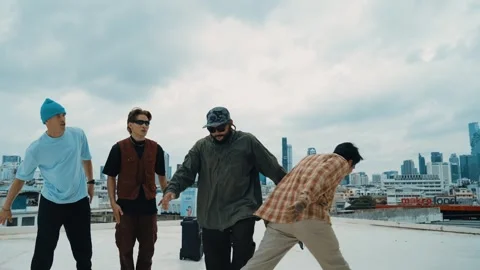 Profession break dancer practice B-boy dance with friends at roof top. hiphop. Stock Footage 266844752