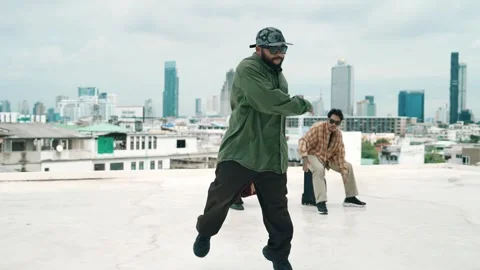 Profession break dancer practice B-boy dance with friends at roof top. hiphop. Stock-Footage 269492307