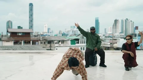 Profession break dancer practice B-boy dance with friends at roof top. hiphop. Stock Footage 270129662