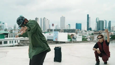 Profession break dancer practice B-boy dance with friends at roof top. hiphop. Stock Footage 271375214