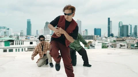 Profession break dancer practice B-boy dance with friends at roof top. hiphop. Stock Footage 271582747