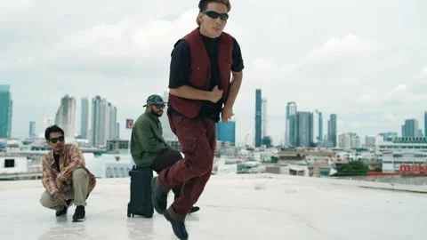 Profession break dancer practice B-boy dance with friends at roof top. hiphop. Stock Footage 271729887