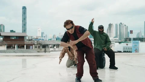 Profession break dancer practice B-boy dance with friends at roof top. hiphop. Stock Footage 271730080