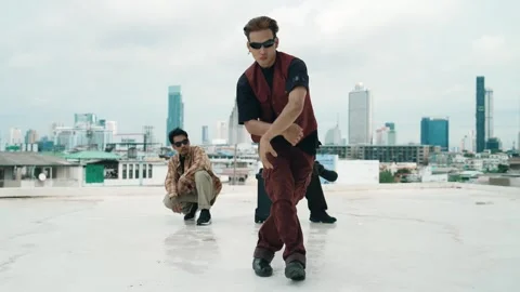 Profession break dancer practice B-boy dance with friends at roof top. hiphop. Stock Footage 272206412