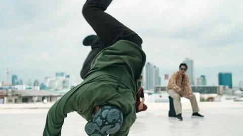 Profession break dancer practice B-boy dance with friends at roof top. hiphop. Stock Footage 272493677