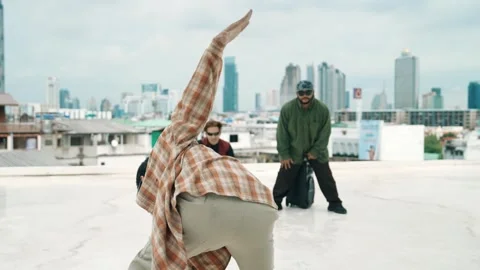 Profession break dancer practice B-boy dance with friends at roof top. hiphop. Stock Footage 272667684