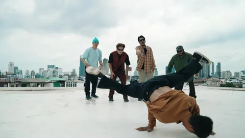 Profession break dancer practice B-boy dance with friends at roof top. hiphop. Stock Footage 272739784
