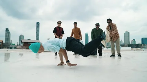 Profession break dancer practice B-boy dance with friends at roof top. hiphop. Stock Footage 273130368