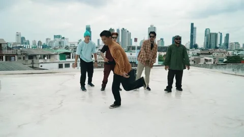 Profession break dancer practice B-boy dance with friends at roof top. hiphop. Stock Footage 273554761