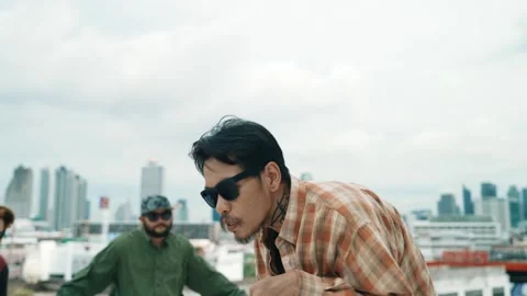 Profession break dancer practice B-boy dance with friends at roof top. hiphop. Stock Footage 273736066