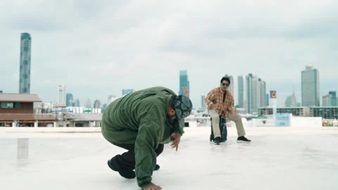 Profession break dancer practice B-boy dance with friends at roof top. hiphop. Stock Footage 274186561