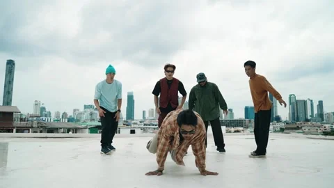Profession break dancer practice B-boy dance with friends at roof top. hiphop. Stock Footage 274186752