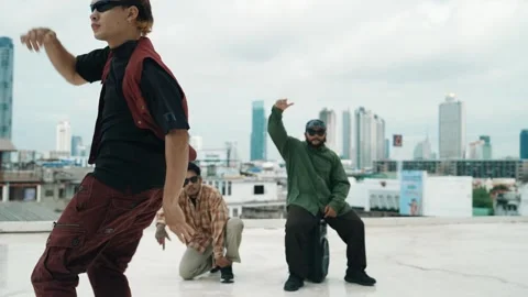 Profession break dancer practice B-boy dance with friends at roof top. hiphop. Stock Footage 274252002