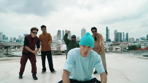 Profession break dancer practice B-boy dance with friends at roof top. hiphop. Stock Footage 274385863